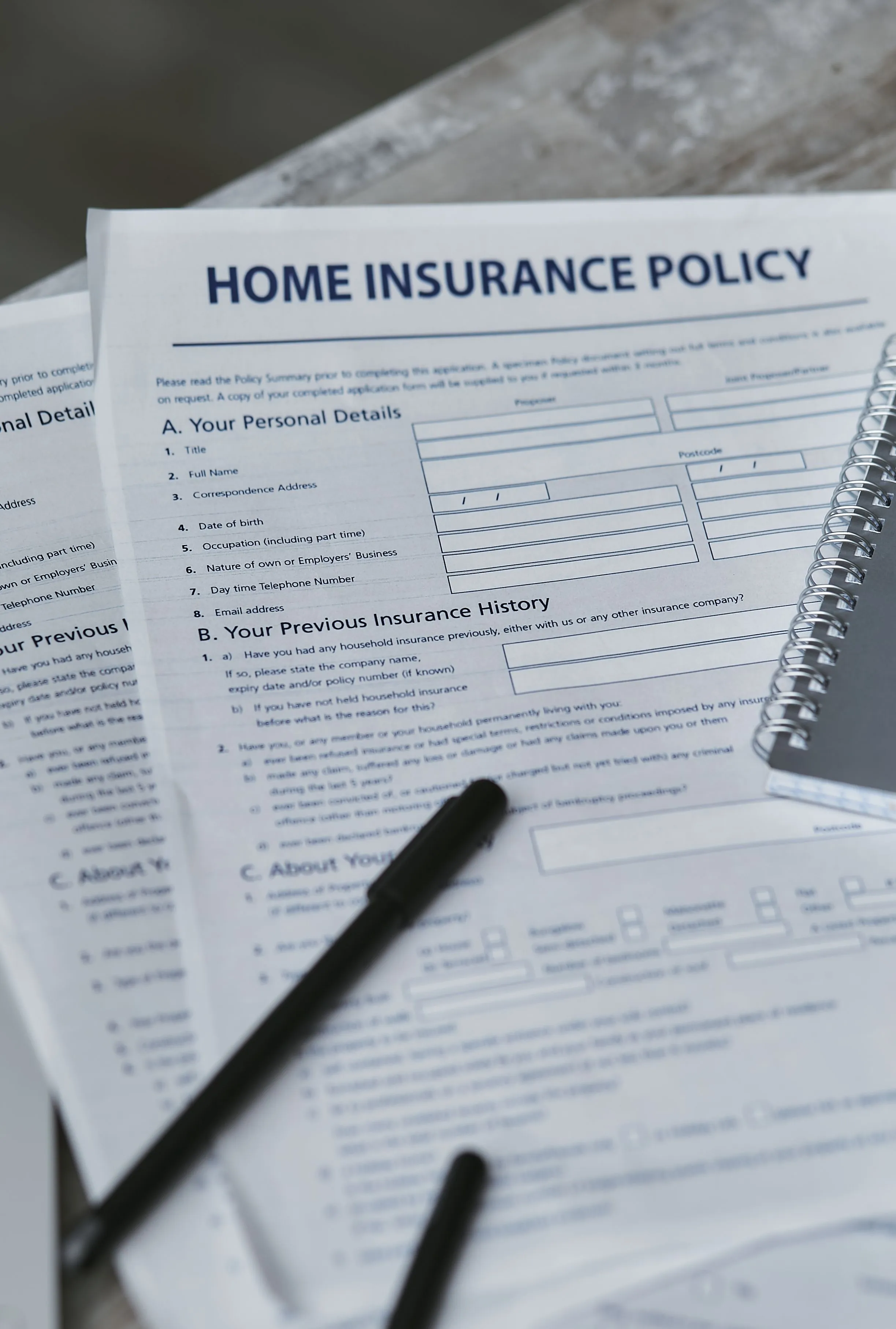 Homeowner reviewing insurance claim paperwork after water damage